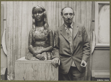 2803-1938 Frank Dobson (1887-1963) Photograph of Frank Dobson standing next to a sculpture by him of a girl done in bronze