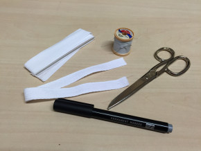 Textile marking kit. The permanent museum number of a recently acquired object is written on a piece of cotton tape and sewn on to the object. © Behnaz Atighi Moghaddam