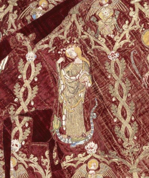 Detail from the Butler-Bowden cope: St. Margaret standing on a writhing dragon, piercing it with a long-stemmed cross, England (made), Italy (woven), 1330-1350. Museum Number: T.36-1955 © Victoria and Albert Museum, London
