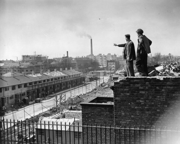 A slum clearance operation in Poplar, East London, 19th April 1951. The workers are standing on the ruins of Trinity Church, largely destroyed in the Blitz. (Photo by Topical Press Agency/Getty Images)