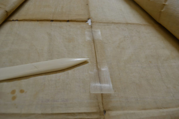 During application of crepeline and Klucel™ G adhesive film, the adhesive in the centre of the patch has been reactivated