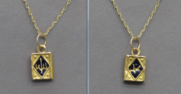 My gold pendant in the shape of a Qur'an with the word ‘Allah’ on the observse and 'Muhamad' on the reverse © Victor Borges