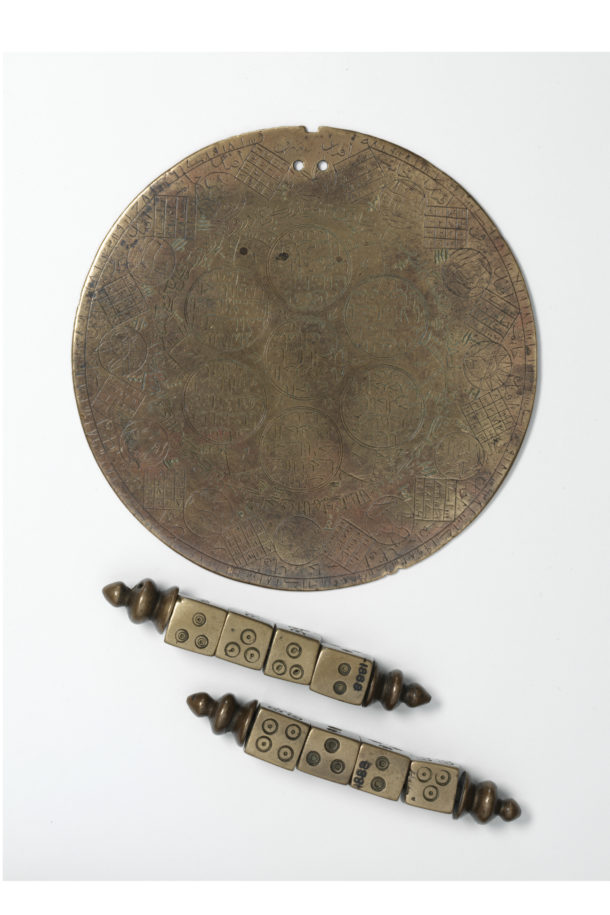Dice and plaque, Iran, 1600-1700. Cast and engraved bronze. Museum number: 505-1888 © Victoria and Albert Museum. The art of using dice for fortune-telling was developed at least 4000 years ago, long before dice were first used to play games.