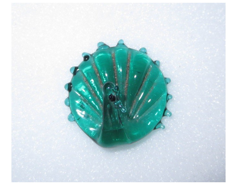 A glass hatpin in the form of a peacock, made by Henry Edward Murphy for Orplid Glassworks.