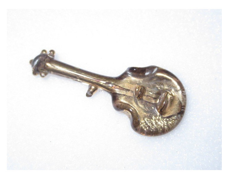 A glass hatpin in the shape of a double bass, made by Henry Edward Murphy for Orplid Glassworks, ca.1950-1960.