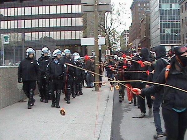 Montreal’s student demonstrators wave donuts to distract riot police in 2012. Many of their homemade fishing lines are decorated with red fabric, emblems of their struggle against tuition hikes.