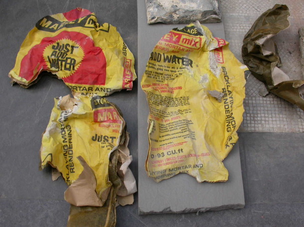 A shredded bag of bricklayers mortar and rendering mix found inside the Finch Monument