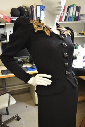 T.399&a-1974 Elsa Schiaparelli, Dress and Jacket with gilt embroidery mounted for ‘Horst Photographer of Style’ on a full figure Proportion Ltd mannequin.