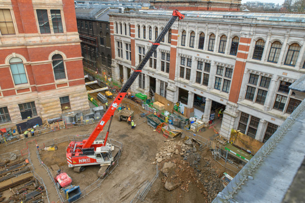 Current construction progress on the Exhibition Road Project site - all disused buildings have been demolished, piling works are complete, and excavation and propping of the site is underway. The three openings in the Western Range (building in the background) will provide a new entrance and lobby for the museum, 2015. © Victoria and Albert Museum, London