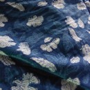 Resist block printed cotton dyed with Indigo.