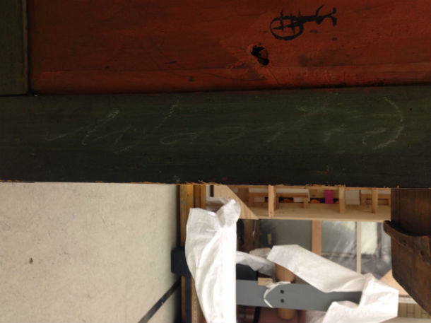On the green surround on the back of the cupboard doors, you can just see faintly written in chalk the word 'Wanted', indicating that this is one of the objects that should be retained © Mariam Rosser-Owen