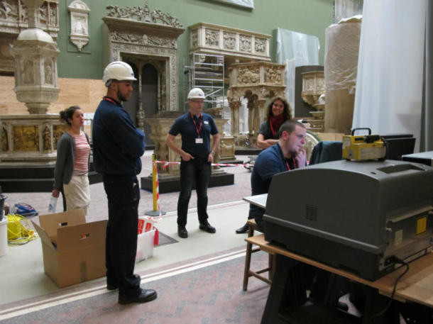 Happy teams of x-ray specialists and conservators working in the Cast Courts in the middle of the night.