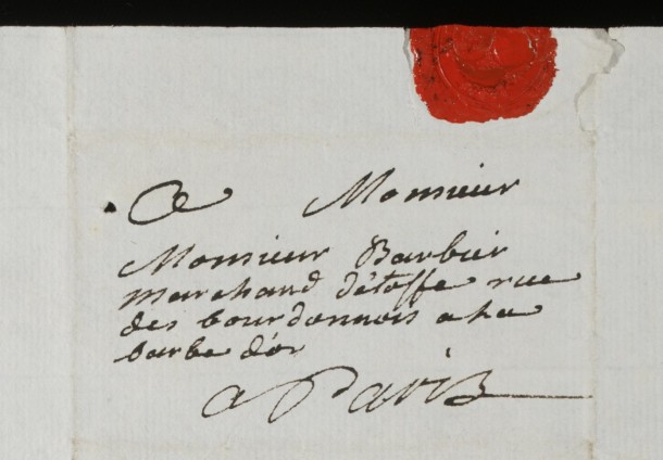Monsieur Barbier Marchand l'etoffe rue des bourdonnois a la barbe d'or Paris. Translation: Mr. Barbier Cloth Merchant Bourdonnois Street at the (sign of the) golden beard Paris.
