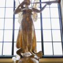 Gilded teak angel by Hibbert C, Binney known as The Spirit of Gaiety and originally designed for the dome of the first Gaiety Theatre, Aldwych, where it was erected in March 1904. Hibbert C. Binney