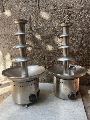 Two used chocolate fountains