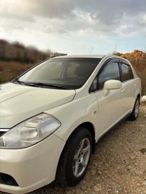 Nissan Tida 2010 — 2