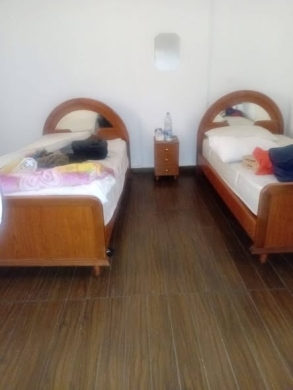 Refrigerator, gas stove, and two beds with mattresses — 3