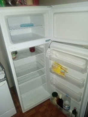 Refrigerator, gas stove, and two beds with mattresses — 2
