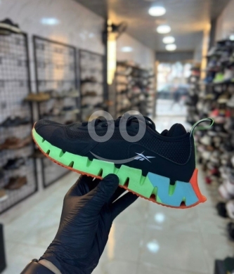 Clothes, Footwear & Accessories in Al Dahye - Original Reebok Zig Dynamica Sneakers - Black/Neon Green/Blue - Size 36 - High-Performance