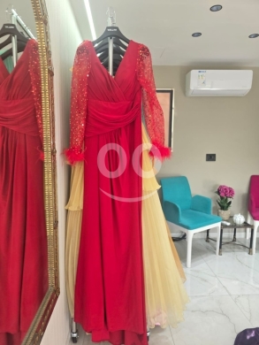 Clothes, Footwear & Accessories in Tripoli - فستان سهرة أحمر طويل وأنيق بأكمام مطرزة وتفاصيل ريش | Elegant Long Red Evening Dress with Sequin Sle