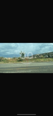 Lands for sale dans Mounjez - للبيع ارضين منجز شارع عام رئيسي ٩٥٠٠م