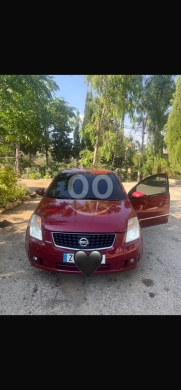 Nissan in Baalback - سيارة نيسان سدان حمراء للبيع بحالة ممتازة | Nissan Red Sedan Car for Sale