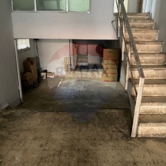 R9-1663 A strategically located property for sale in Zahriyeh, Tripoli, featuring a 142 sqm apartment and a 104 sqm shop with mezzanine.