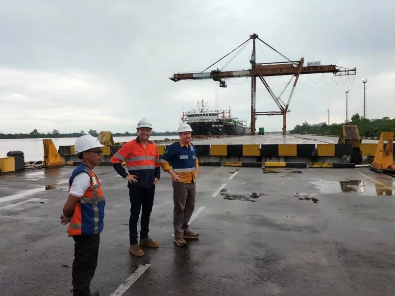 A group of men wearing hard hats

Description automatically generated