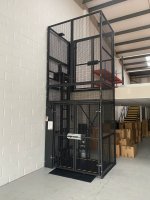 Enclosed mezzanine goods lift for vertical material transport
