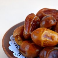 a close up of dates light brown dark golden