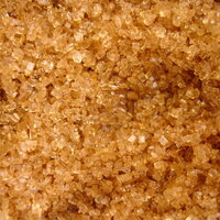 light brown soft sugar granules sparkling shiny