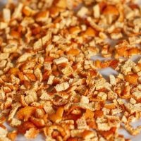 a close up of oranges with leaves