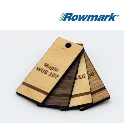 Rowmark Laser Wood Sheet samples in various natural tones with engraved labels.
