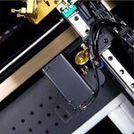 Close-up of FLUX Beambox laser head and rail mechanism