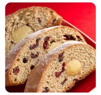 three slices of cakes with red fruit incorporated and white marzipan on a red basket