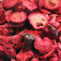 a close up of pink purple violet cranberries cranberry freeze dried fruit