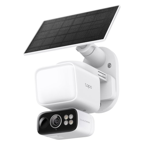 Solar powered floodlight pan and tilt security camera mounted on exterior wall 