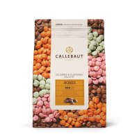 a bag of barry callebaut flavoured chocolate callets, honey, orange, brown, pink, green