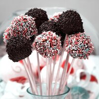 cake pops with red sprinkles on them and chocolate brown sprinkles
