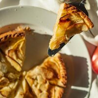 yellow pie with fruit slices on top