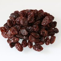 a pile of brown red prune raisins