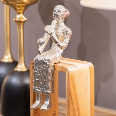 Sitting musician flute silver