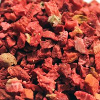 close up of bright red sliced and whole strawberries with leaves, strawberry leaf freeze dried fruit