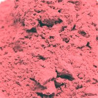 whole and sliced bright red pink strawberries on a wooden board