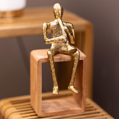 Sitting musician trumpet gold