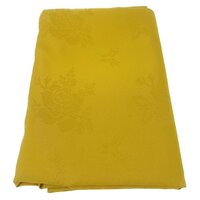 Gold table linen with rose pattern.