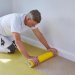 Painter Using 625mm x 25m ProDec Carpet Protector Film