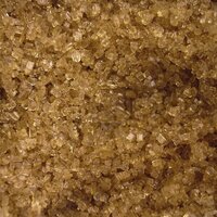 dark brown soft sugar granules sparkling shiny