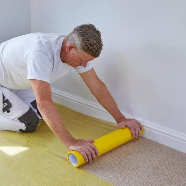 Painter Using 625mm x 25m ProDec Carpet Protector Film