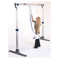 The Easytrack Free standing hoist by Oxford Mobility is a lightweight being used by a person